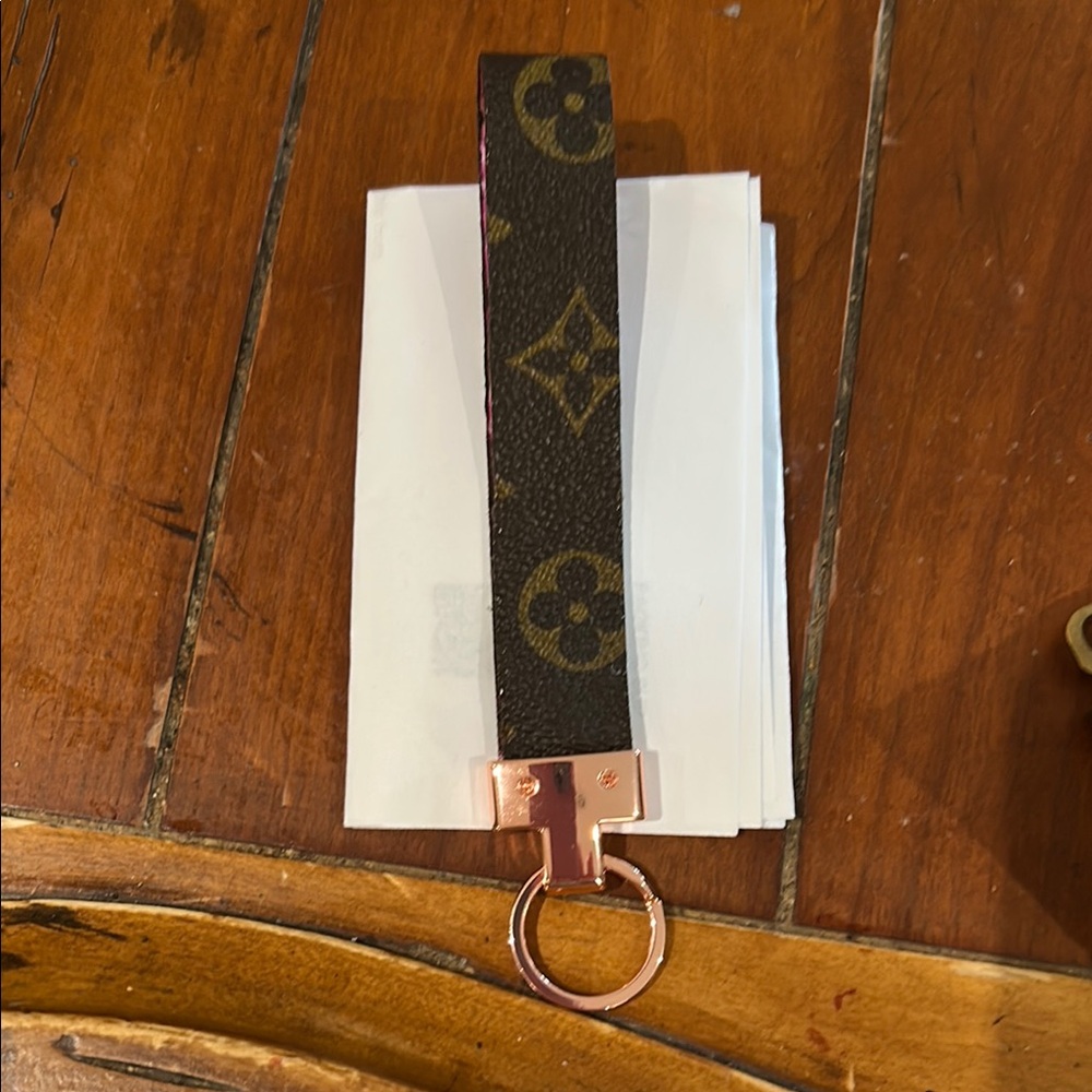 Luxury Brown Keychain Brand new without tags  rose Gold Accents.